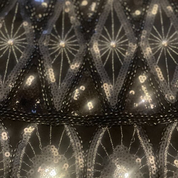 This chic mini skirt features a striking grey and black sequin pattern - Picture 11 of 11